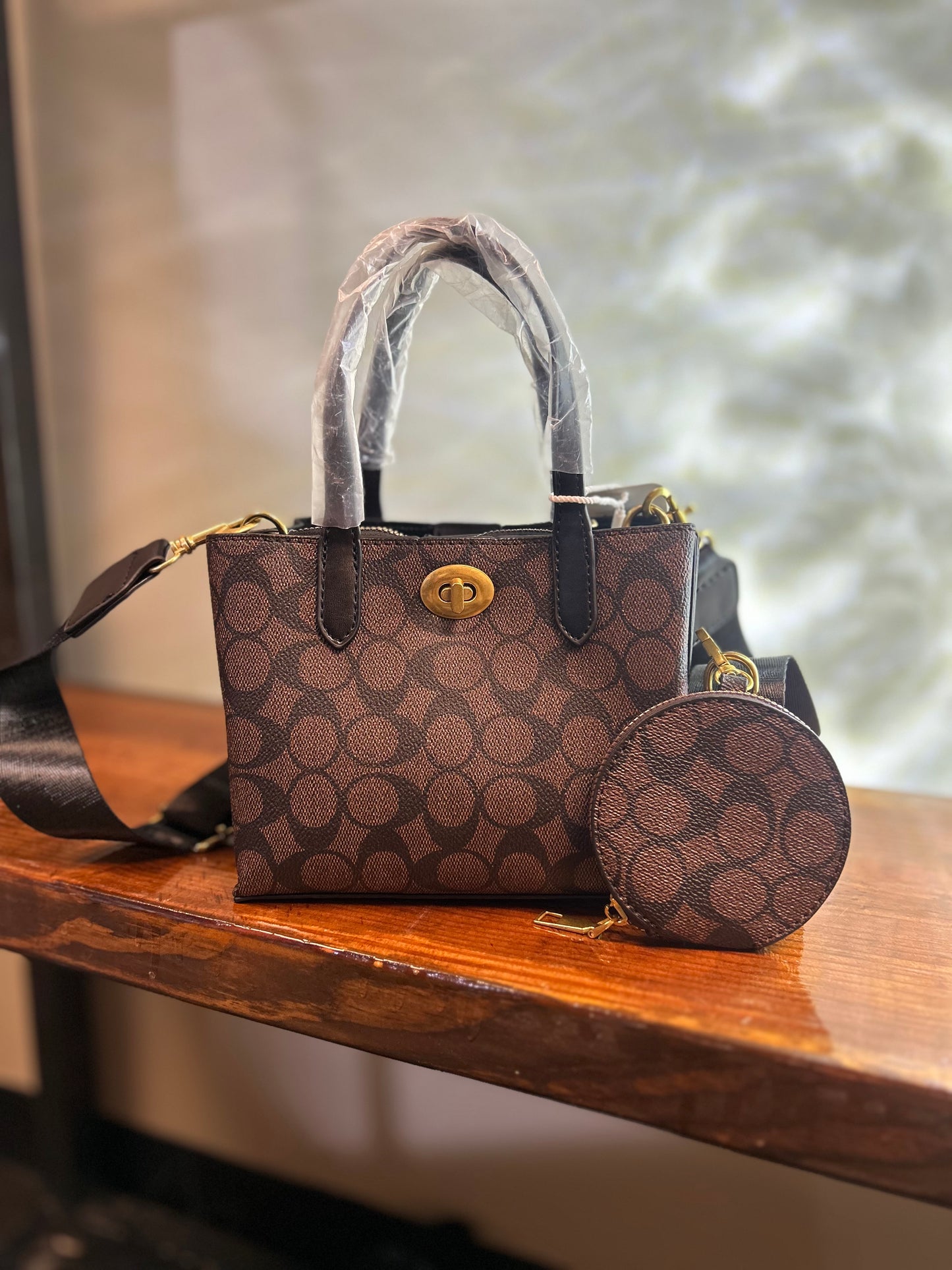 COA MINI BUCKET STYLE PURSE 111