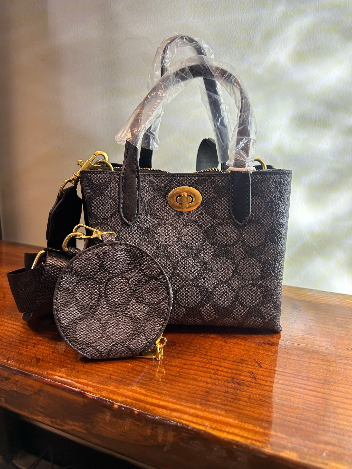COA MINI BUCKET STYLE PURSE 111
